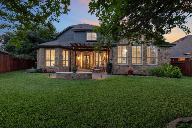 3022 Luminoso Ln E, Round Rock, TX 78681 - back of house featuring stone siding, a pergola, a patio area, and roof with shingles