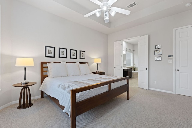 3022 Luminoso Ln E, Round Rock, TX 78681 - bedroom featuring light colored carpet, baseboards, ensuite bath, and ceiling fan