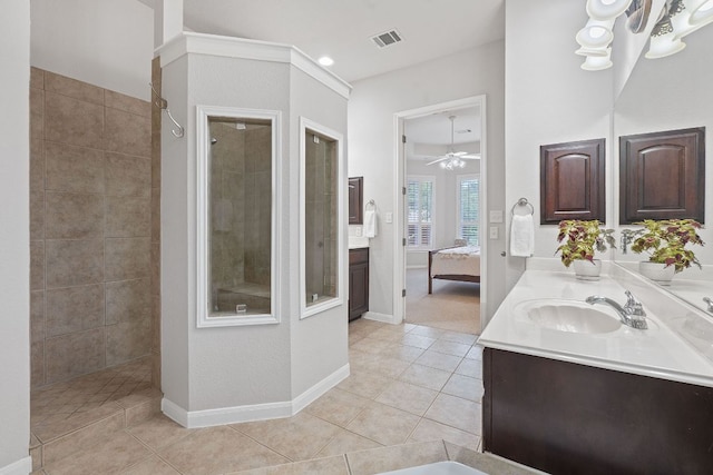3022 Luminoso Ln E, Round Rock, TX 78681 - ensuite bathroom with double vanity, a walk in shower, ceiling fan, and tile patterned flooring