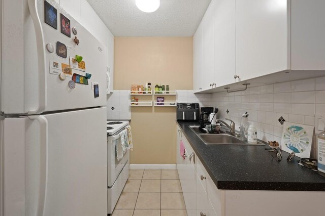 801 Terrell Hill Dr, Austin, TX 78704 - kitchen with white appliances, a sink, white cabinets, decorative backsplash, and dark countertops