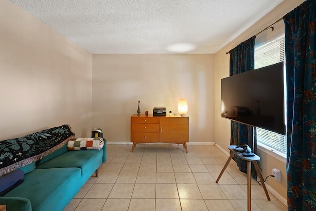 801 Terrell Hill Dr, Austin, TX 78704 - living room featuring a textured ceiling, baseboards, and tile patterned floors