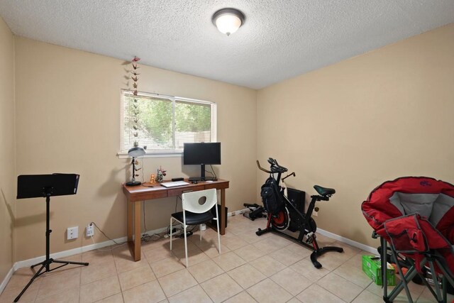801 Terrell Hill Dr, Austin, TX 78704 - home office with a textured ceiling, baseboards, and light tile patterned floors