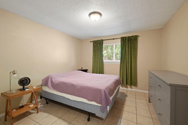 801 Terrell Hill Dr, Austin, TX 78704 - bedroom featuring a textured ceiling, baseboards, and light tile patterned floors