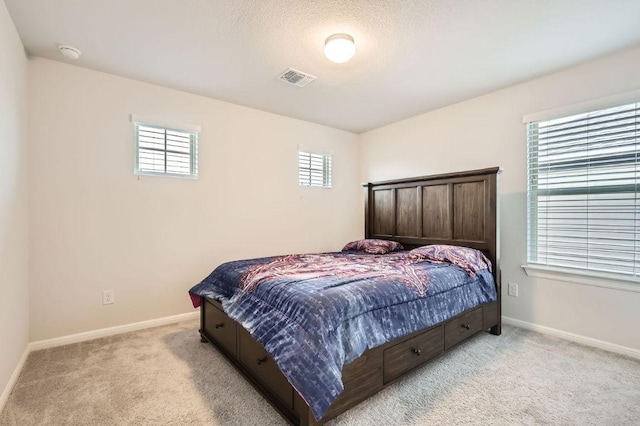149 Woods Edge Ln, Georgetown, TX 78628 - bedroom with light carpet and baseboards