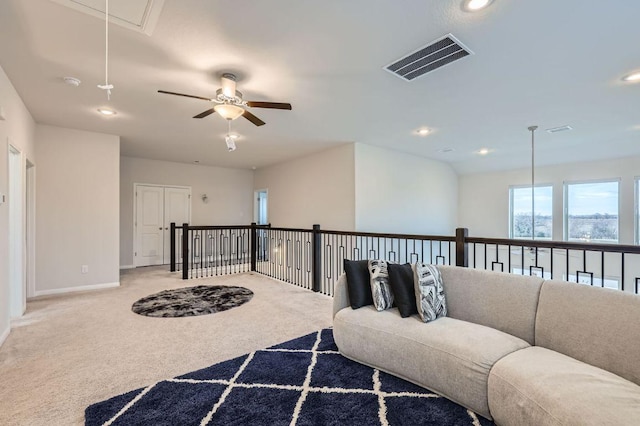 149 Woods Edge Ln, Georgetown, TX 78628 - carpeted living room featuring attic access, baseboards, recessed lighting, and a ceiling fan