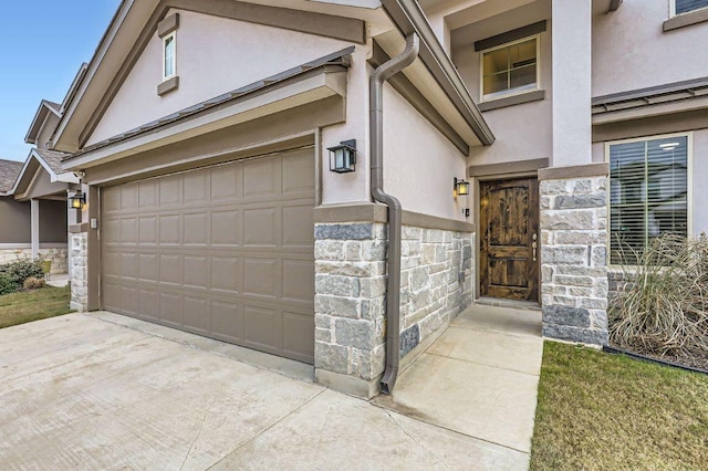 149 Woods Edge Ln, Georgetown, TX 78628 - entrance to property featuring stucco siding, stone siding, and driveway