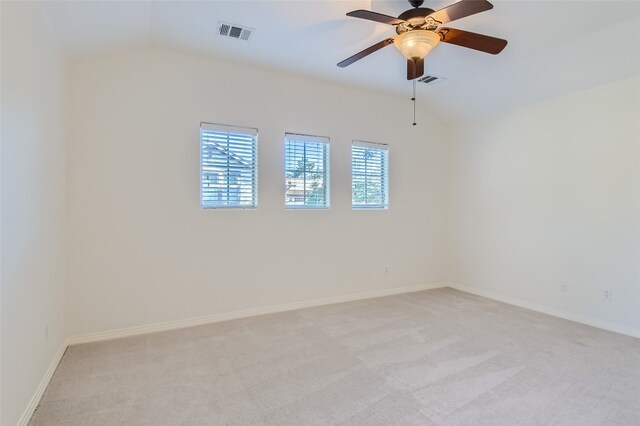 9707 Anderson Mill Rd Unit 32, Austin, TX 78750 - spare room with vaulted ceiling, light carpet, baseboards, and a ceiling fan