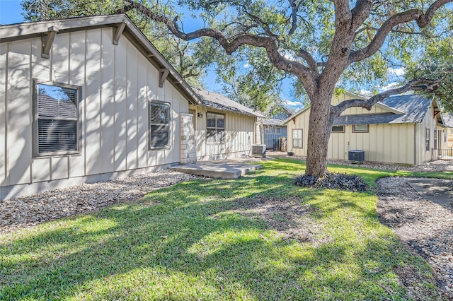 9707 Anderson Mill Rd Unit 32, Austin, TX 78750 - view of green lawn with central AC unit and a patio area