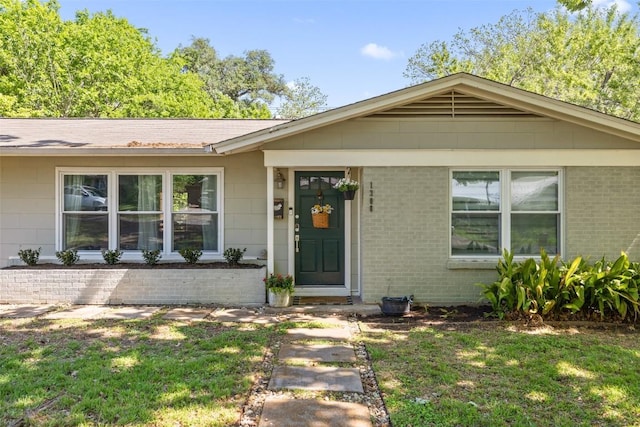1308 Berkshire Dr, Austin, TX 78723 - view of front facade with a front lawn and brick siding