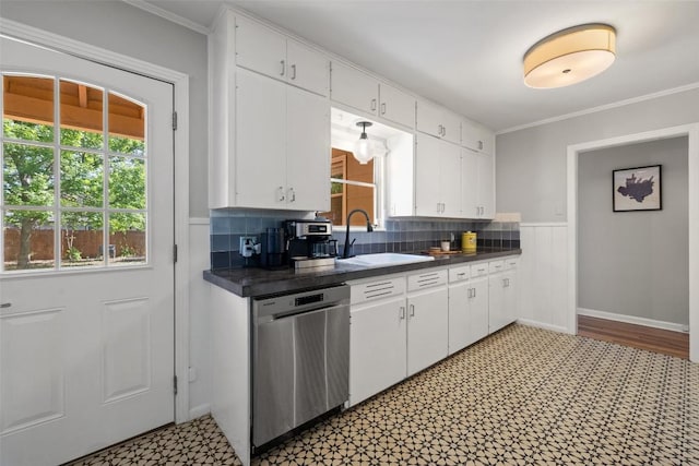 1308 Berkshire Dr, Austin, TX 78723 - kitchen featuring dishwasher, a sink, dark countertops, white cabinetry, and ornamental molding