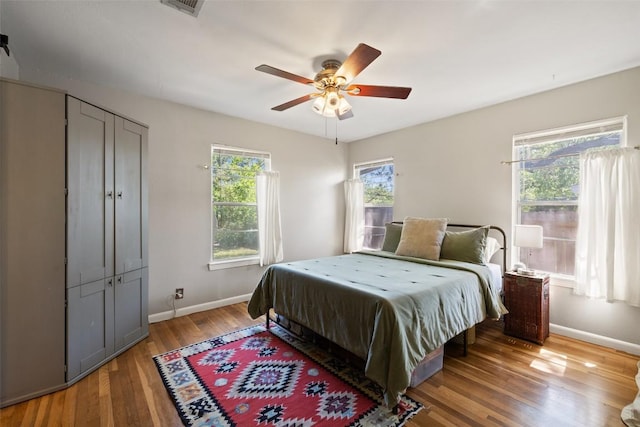1308 Berkshire Dr, Austin, TX 78723 - bedroom with light wood finished floors, baseboards, and ceiling fan