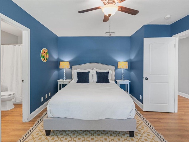 2600 Cockburn Dr, Austin, TX 78745 - bedroom with wood finished floors and ceiling fan