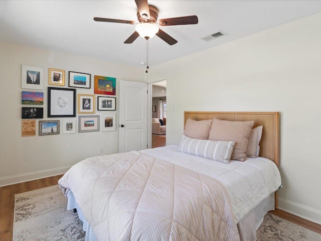 2600 Cockburn Dr, Austin, TX 78745 - bedroom featuring wood finished floors and a ceiling fan