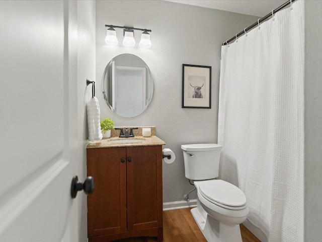 2600 Cockburn Dr, Austin, TX 78745 - bathroom with vanity, wood finished floors, and curtained shower