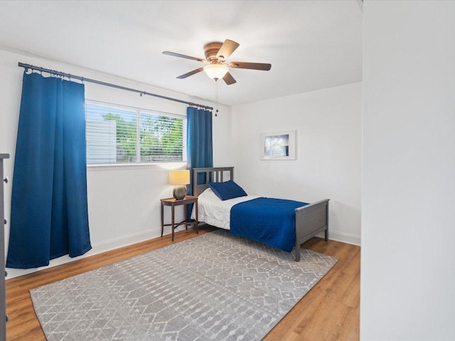 2600 Cockburn Dr, Austin, TX 78745 - bedroom with wood finished floors and a ceiling fan