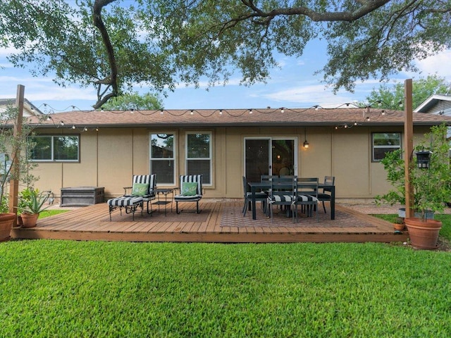 2600 Cockburn Dr, Austin, TX 78745 - rear view of property with a deck and a yard