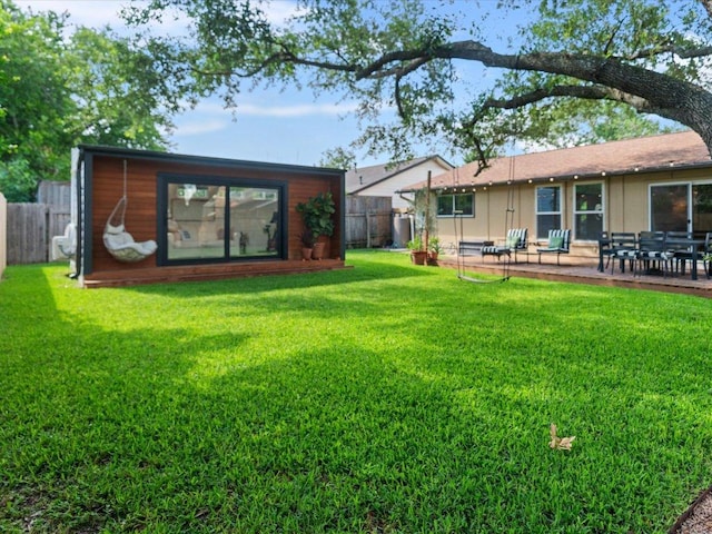 2600 Cockburn Dr, Austin, TX 78745 - back of property with a fenced backyard, an outbuilding, and a patio area