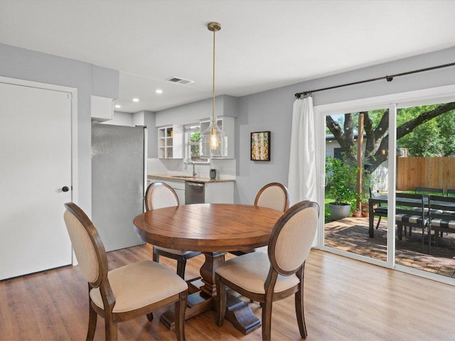 2600 Cockburn Dr, Austin, TX 78745 - dining room featuring light wood-style flooring and recessed lighting
