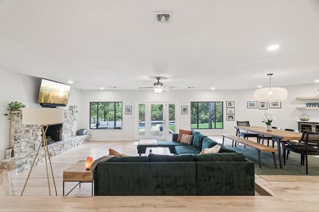3902 Knollwood Dr Unit A, Austin, TX 78731 - living room featuring light wood finished floors, a fireplace, recessed lighting, ceiling fan, and baseboards