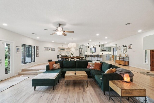3902 Knollwood Dr Unit A, Austin, TX 78731 - living room with light wood finished floors, ceiling fan, and recessed lighting