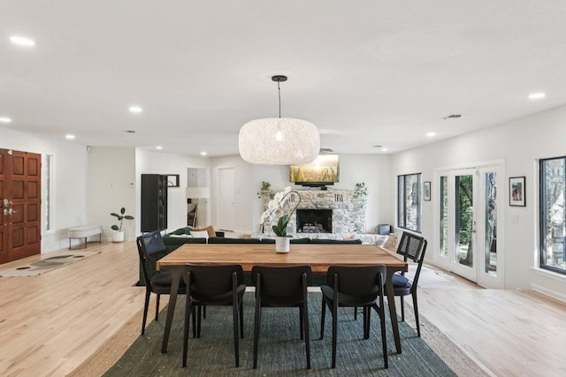 3902 Knollwood Dr Unit A, Austin, TX 78731 - dining space featuring light wood-style flooring, recessed lighting, and a stone fireplace