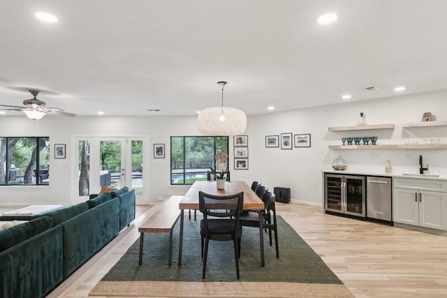 3902 Knollwood Dr Unit A, Austin, TX 78731 - dining room with wine cooler, bar area, light wood finished floors, plenty of natural light, and recessed lighting
