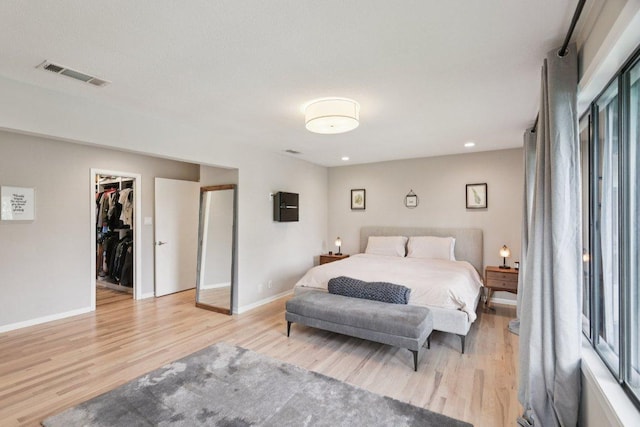 3902 Knollwood Dr Unit A, Austin, TX 78731 - bedroom with light wood-style floors, a spacious closet, baseboards, a closet, and recessed lighting