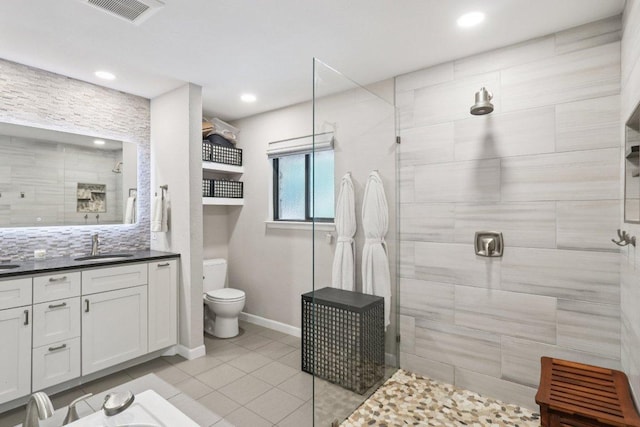 3902 Knollwood Dr Unit A, Austin, TX 78731 - bathroom with vanity, tile patterned floors, a walk in shower, recessed lighting, and decorative backsplash