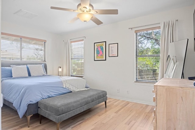 3902 Knollwood Dr Unit A, Austin, TX 78731 - bedroom with multiple windows, light wood-style floors, and ceiling fan