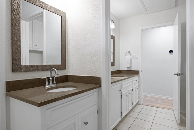 3902 Knollwood Dr Unit A, Austin, TX 78731 - bathroom featuring two vanities and tile patterned floors