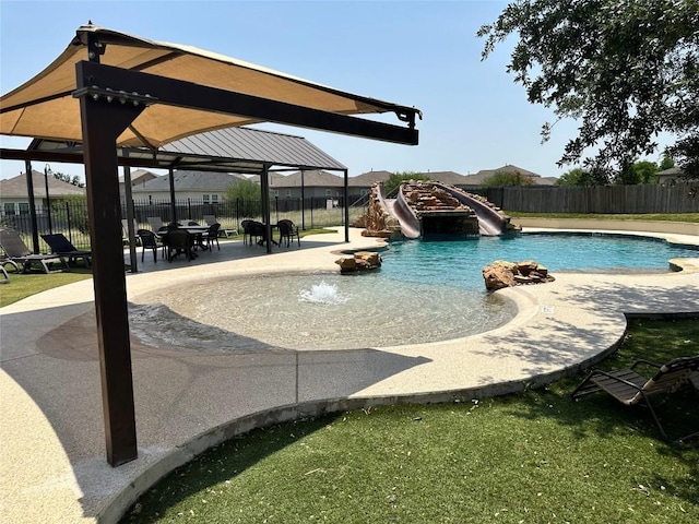 814 Covent Dr, Kyle, TX 78640 - view of swimming pool featuring a water slide, a gazebo, a patio area, and a fenced backyard