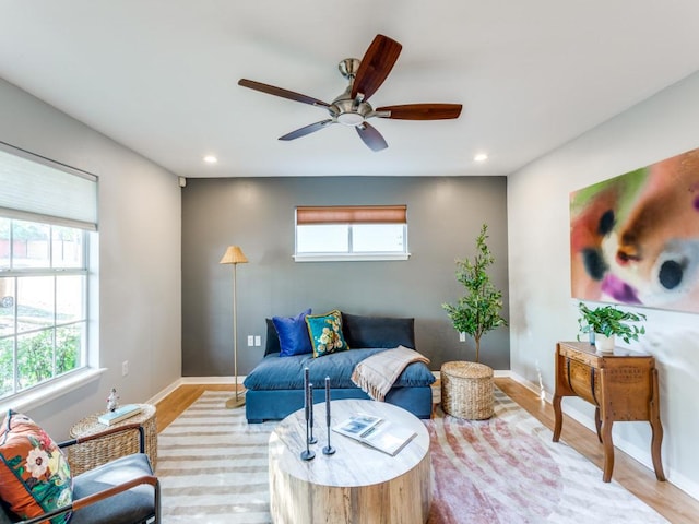 1705 Adriane Dr, Austin, TX 78721 - living room with recessed lighting, light wood-style floors, a ceiling fan, and baseboards