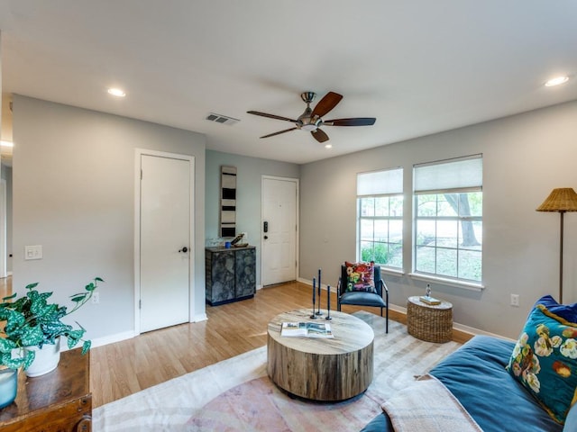 1705 Adriane Dr, Austin, TX 78721 - living area with light wood finished floors, a ceiling fan, baseboards, and recessed lighting