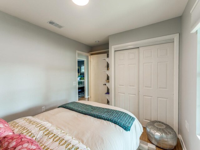 1705 Adriane Dr, Austin, TX 78721 - bedroom featuring a closet and wood finished floors