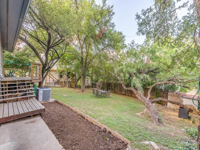 1705 Adriane Dr, Austin, TX 78721 - view of yard featuring cooling unit and a deck