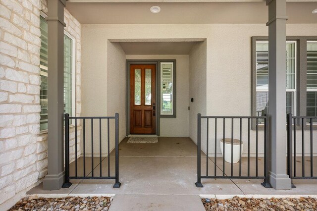110 Chuckwagon Trl, Georgetown, TX 78633 - view of exterior entry with stucco siding