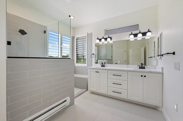 110 Chuckwagon Trl, Georgetown, TX 78633 - full bath with a walk in shower, double vanity, tile patterned floors, and a baseboard heating unit