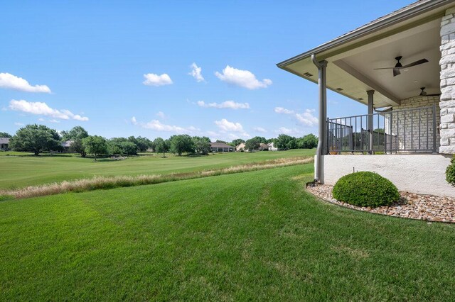 110 Chuckwagon Trl, Georgetown, TX 78633 - view of grassy yard with ceiling fan and a patio area