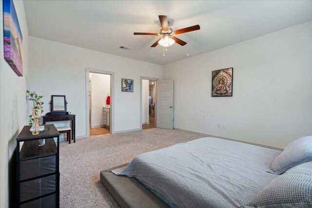 13705 Mc Arthur Dr, Manor, TX 78653 - bedroom with light carpet, baseboards, and ceiling fan