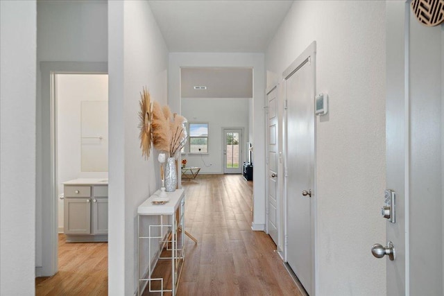 13705 Mc Arthur Dr, Manor, TX 78653 - corridor featuring light wood-style flooring and baseboards