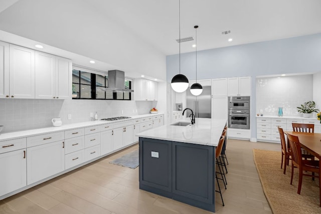 6202 Nasco Dr, Austin, TX 78757 - kitchen featuring a sink, decorative backsplash, extractor fan, white cabinets, and recessed lighting