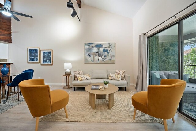 8617 Putnam Dr Unit C, Austin, TX 78757 - living area with high vaulted ceiling, wood finished floors, a ceiling fan, and baseboards