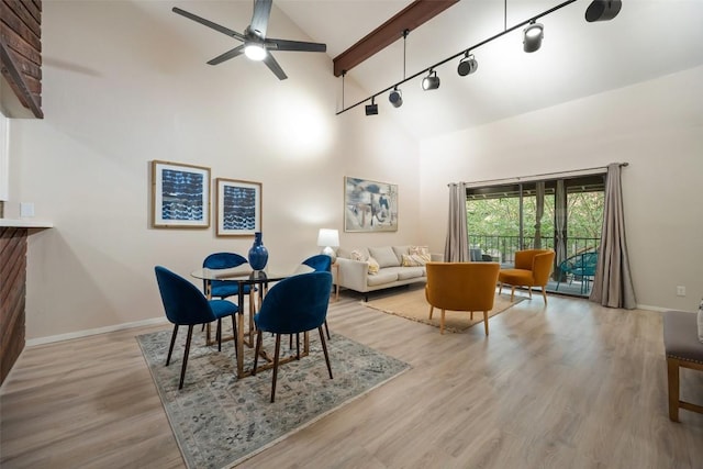 8617 Putnam Dr Unit C, Austin, TX 78757 - dining space with high vaulted ceiling, wood finished floors, a ceiling fan, beam ceiling, and rail lighting