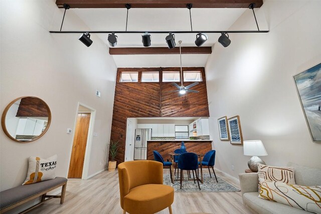 8617 Putnam Dr Unit C, Austin, TX 78757 - living area with track lighting, a high ceiling, light wood-style floors, baseboards, and ceiling fan