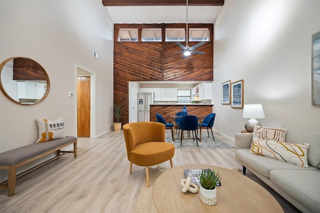 8617 Putnam Dr Unit C, Austin, TX 78757 - living area with a high ceiling, baseboards, ceiling fan, and light wood-style flooring