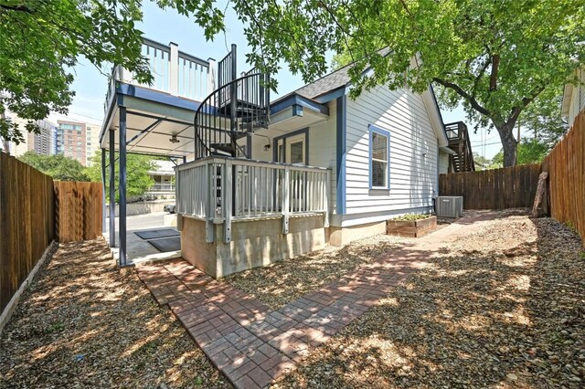1169 Curve St, Austin, TX 78702 - view of side of property with a fenced backyard and cooling unit