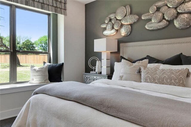 12109 Maypole Bnd, Austin, TX 78717 - bedroom with baseboards and wood finished floors