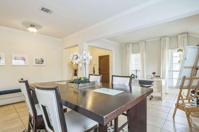 340 Beretta Cir, Georgetown, TX 78628 - dining area featuring light tile patterned flooring and ornamental molding