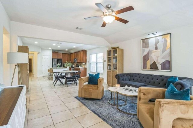 340 Beretta Cir, Georgetown, TX 78628 - living area with light tile patterned floors, a ceiling fan, recessed lighting, and vaulted ceiling