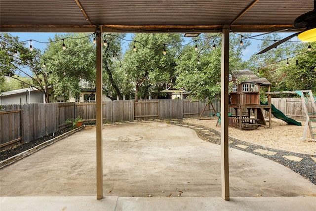 7420 Jaborandi Dr, Austin, TX 78739 - fenced backyard with a playground, a patio, and a ceiling fan